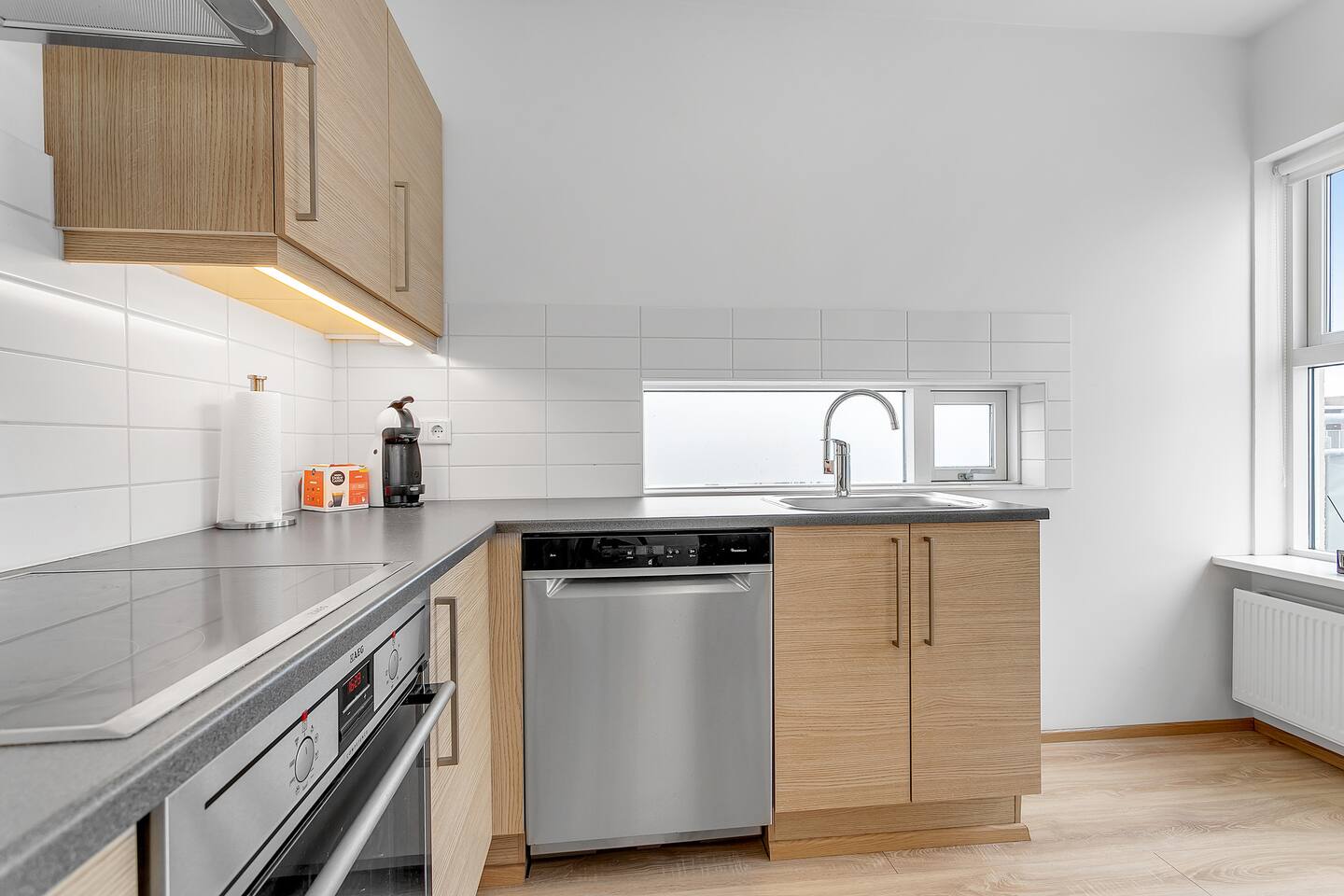 Dining table set up next to kitchen